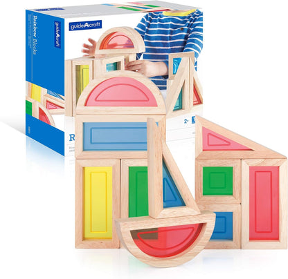 Rainbow colored wooden blocks stacked into a small tower – view 2