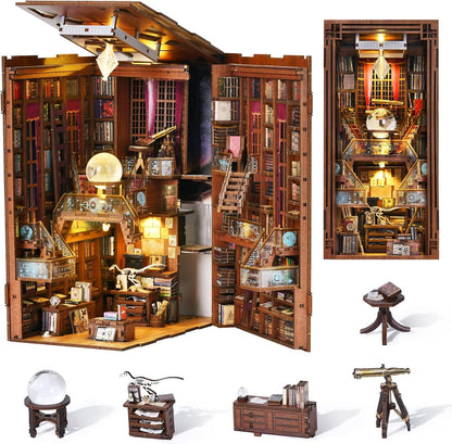 Lit fantasy castle book nook diorama standing between books on a shelf – view 14