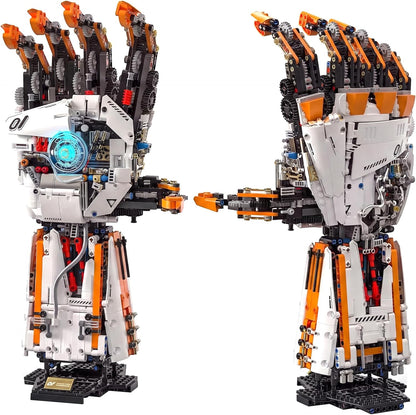Brick-built robotic arm with gripper next to a remote controller – view 2