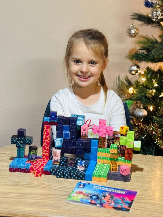 Magnetic cubes built into a forest scene with animal homes and a stream
