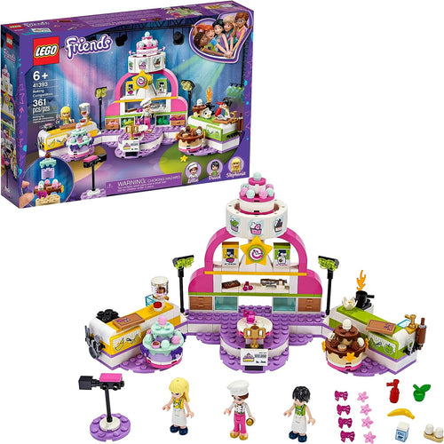 Brick-built baking contest kitchen with ovens, colorful cakes and three figures