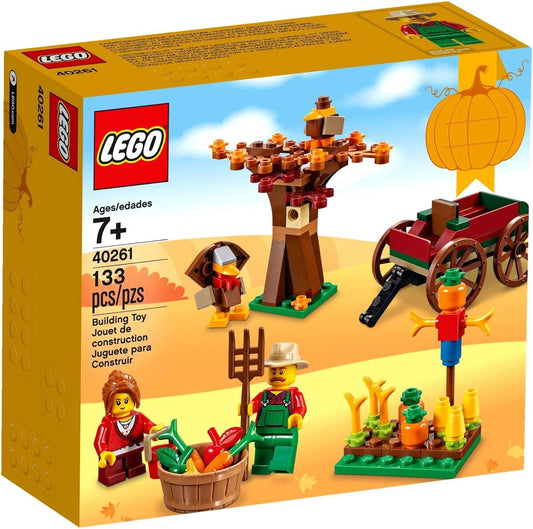 Built autumn harvest scene with carriage, turkey, scarecrow and two figures