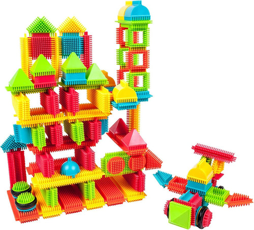 Colorful bristle lock blocks built into a wheeled vehicle beside a toy drill
