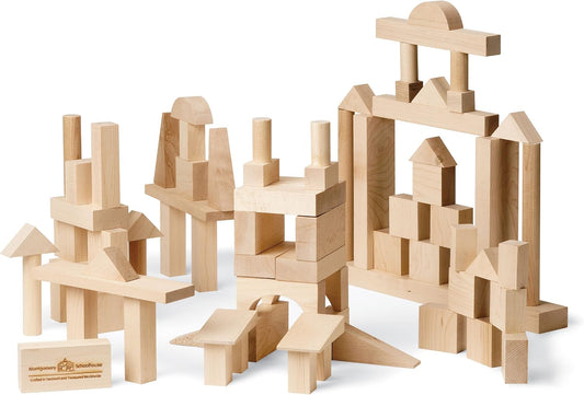 Unfinished maple wooden building blocks in assorted shapes stacked into a tower