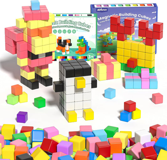 Rainbow of 1-inch magnetic cubes built into a small house and tower shapes