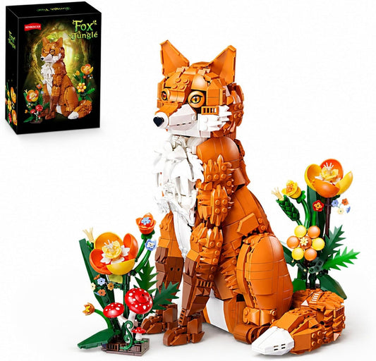 Brick-built orange fox sitting among colorful flowers