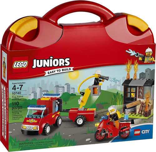 Red carry case opened beside a brick-built fire vehicle, trailer and firefighters