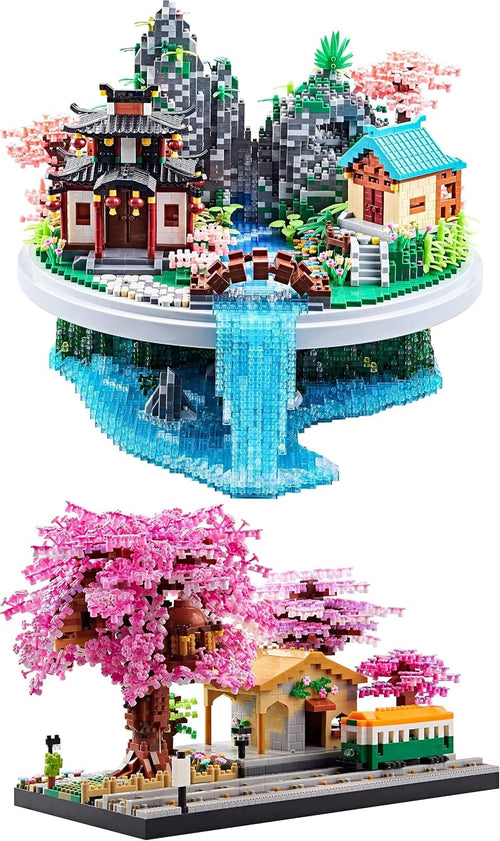 Micro-block Chinese village with pink peach trees beside a cherry blossom train station