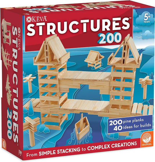 Natural wooden planks stacked into a tall lattice tower beside an idea book