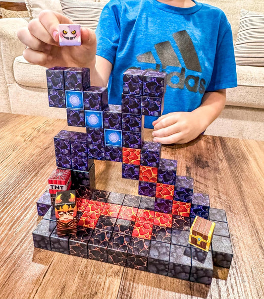 Colorful magnetic cubes built into a small volcano, castle and forest scene