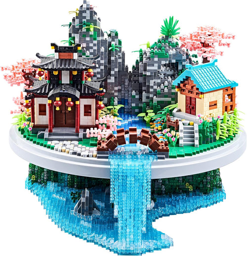Micro block model of a red-walled Chinese courtyard under a pink blossoming peach tree