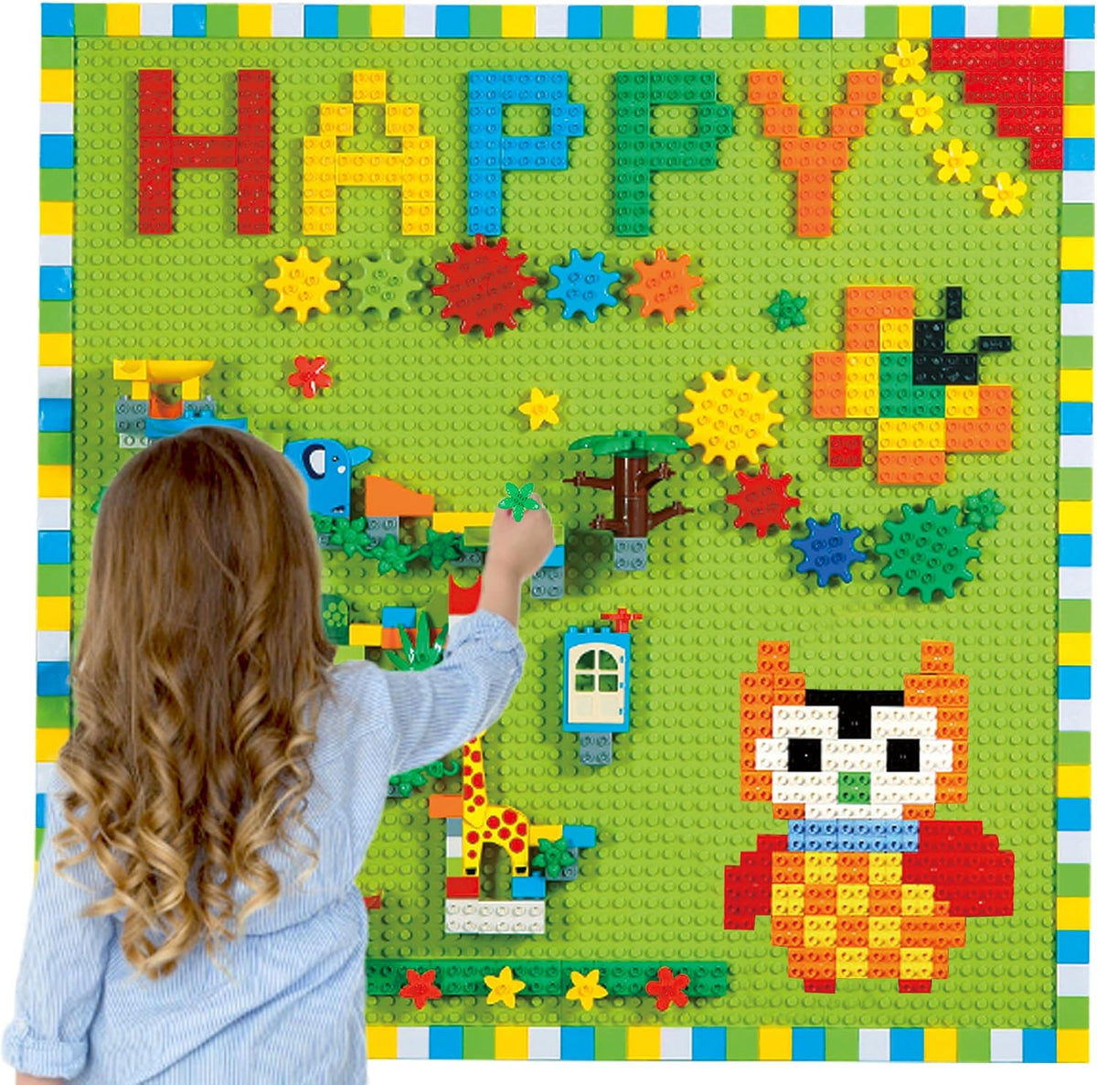 Colorful building blocks, gears and marble run track mounted on wall baseplates