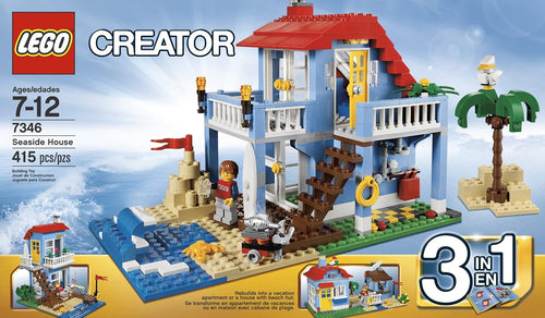 Brick-built two-story seaside house with beach hut, palm tree and surfer