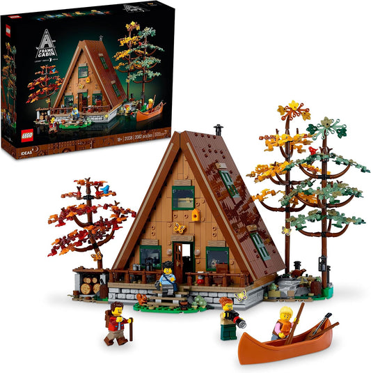 Built A-frame cabin brick model with trees, canoe and small figures