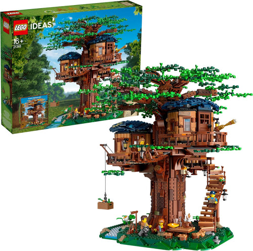 Large brick tree with green leaves holding three wooden-style cabins on a grassy base