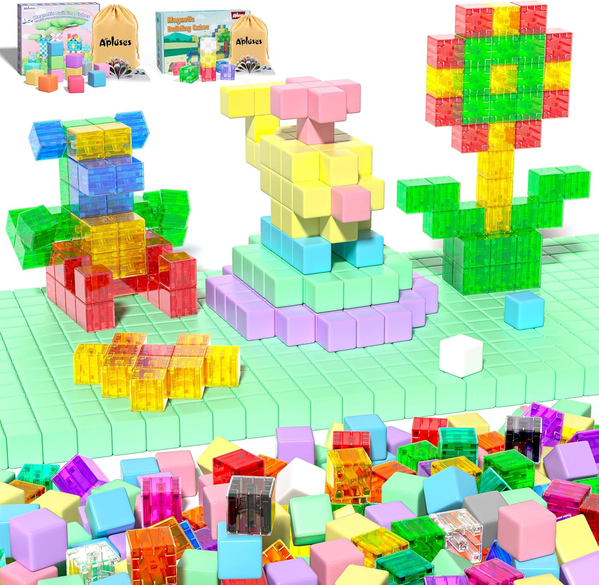 Colorful magnetic cubes built into a small farm scene with a barn and trees