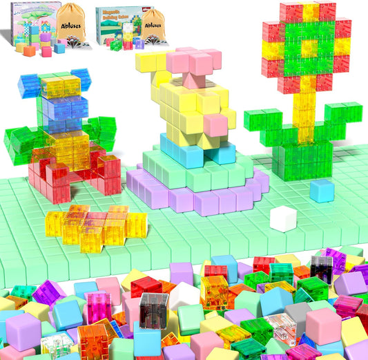 Colorful magnetic cubes built into a small farm scene with a barn and trees